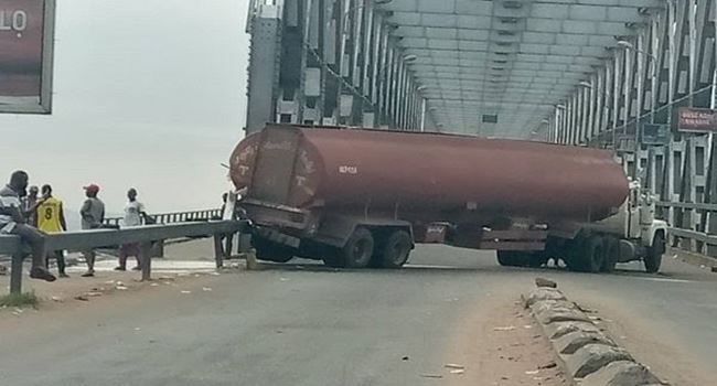 Tragedy averted as petrol tanker spills content on Niger bridge