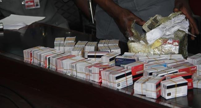 Customs hands over Dubai bound passenger arrested with 2,886 ATM cards to EFCC